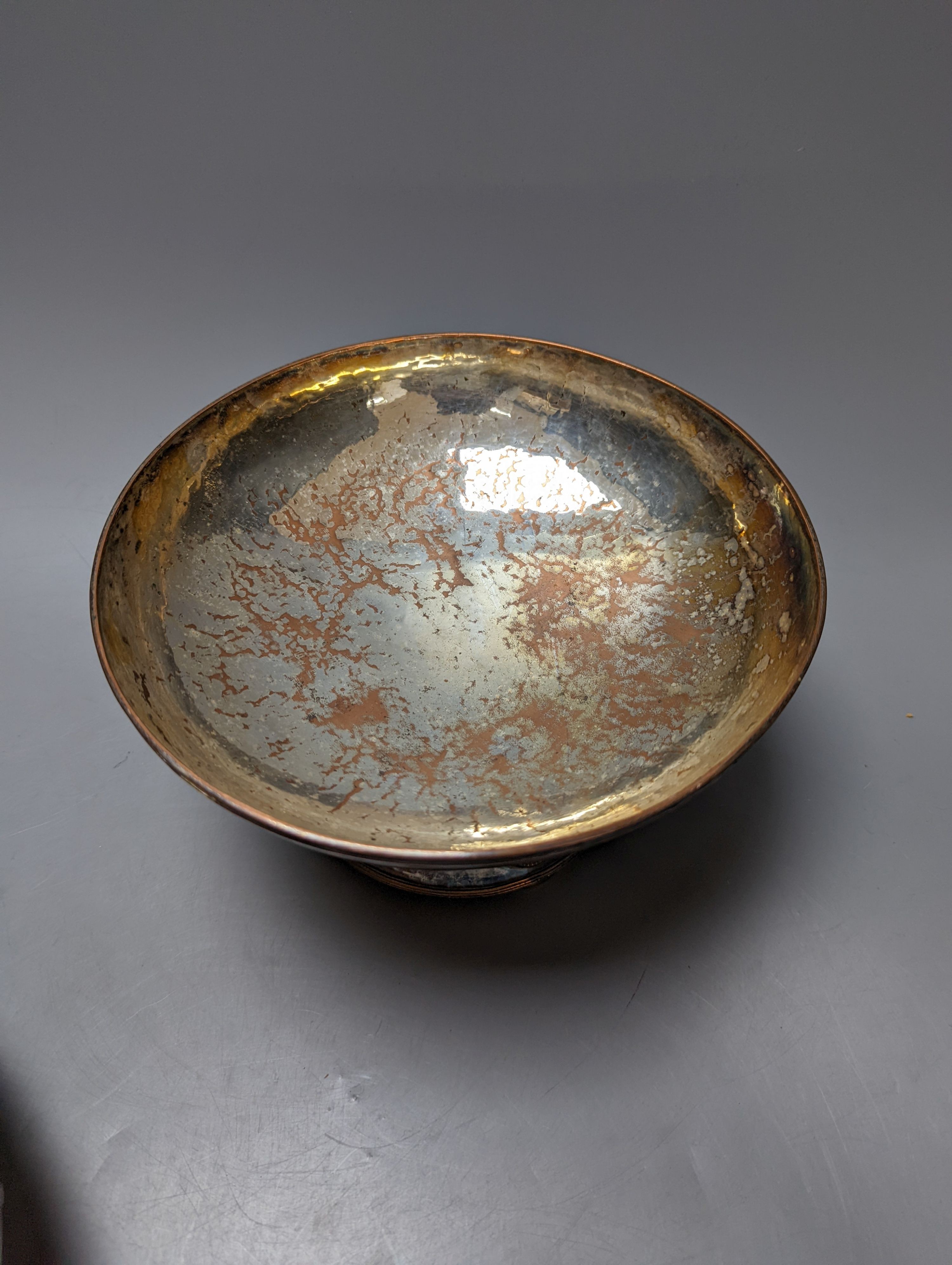 A Tudric pewter oval bowl, model no. 0535, 25cm long and an Arts & Crafts style plated pedestal bowl, 21.5cm diameter